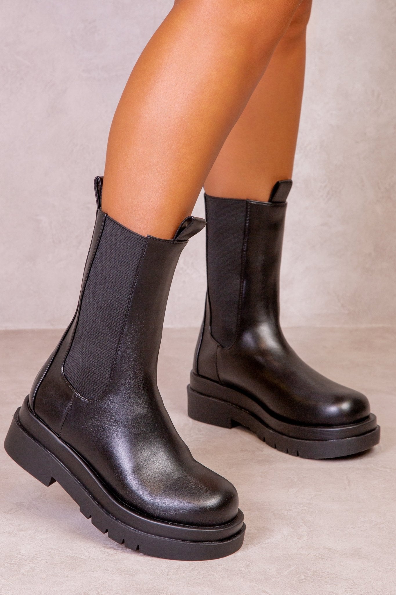 STACEY STACKED BOOTS IN BLACK FAUX LEATHER - Popular trends empire