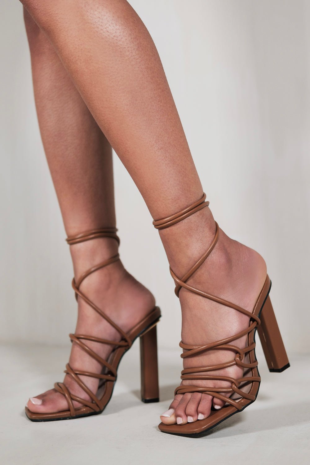 EMILIA HIGH HEELS WITH A TIE LEG AND CROSS OVER STRAP DETAIL IN CHOCOLATE BROWN FAUX LEATHER - Popular trends empire