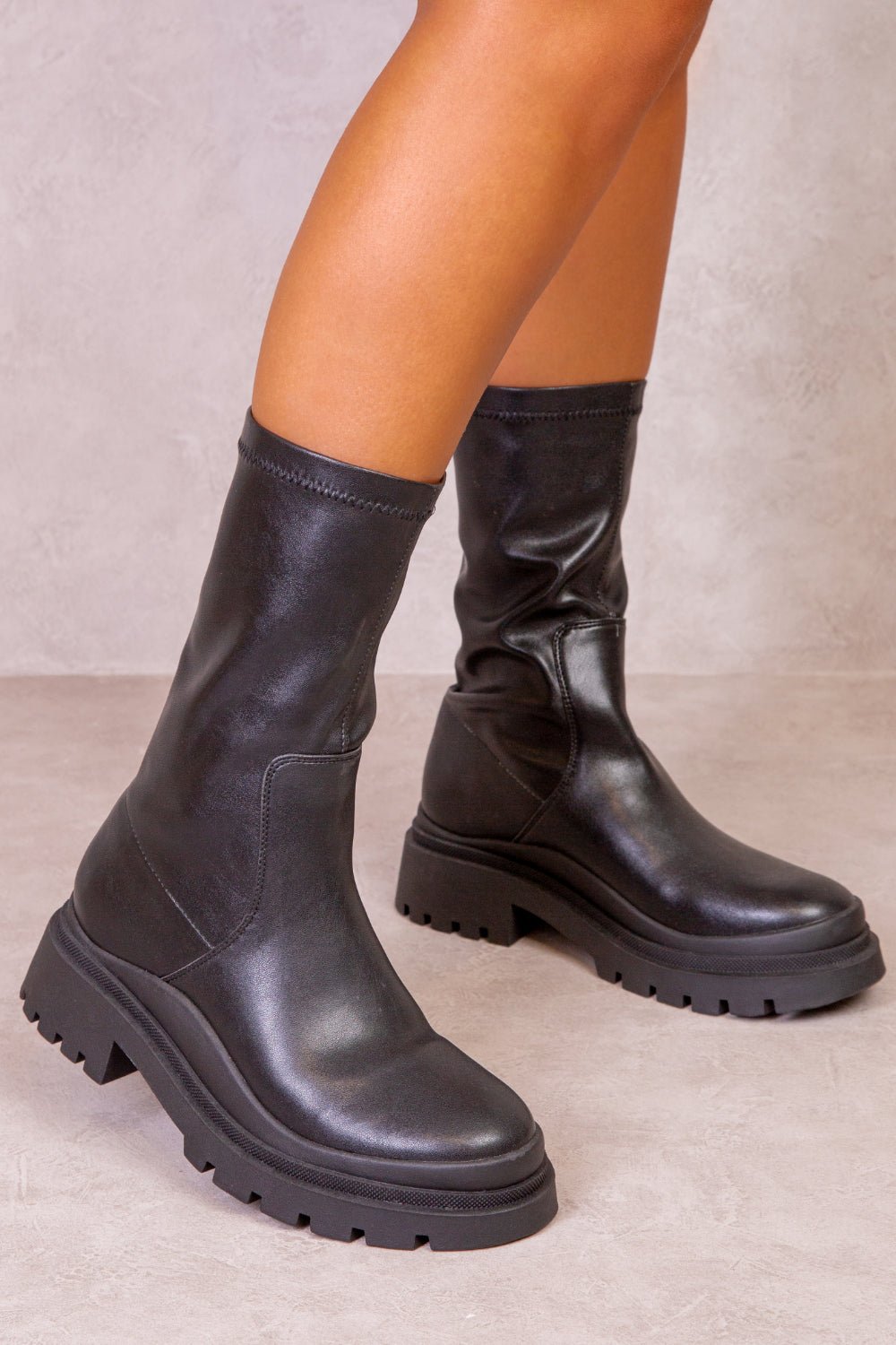 HOLLIE PU ANKLE BOOT WITH CHUNKY HEEL IN BLACK FAUX LEATHER - Popular trends empire