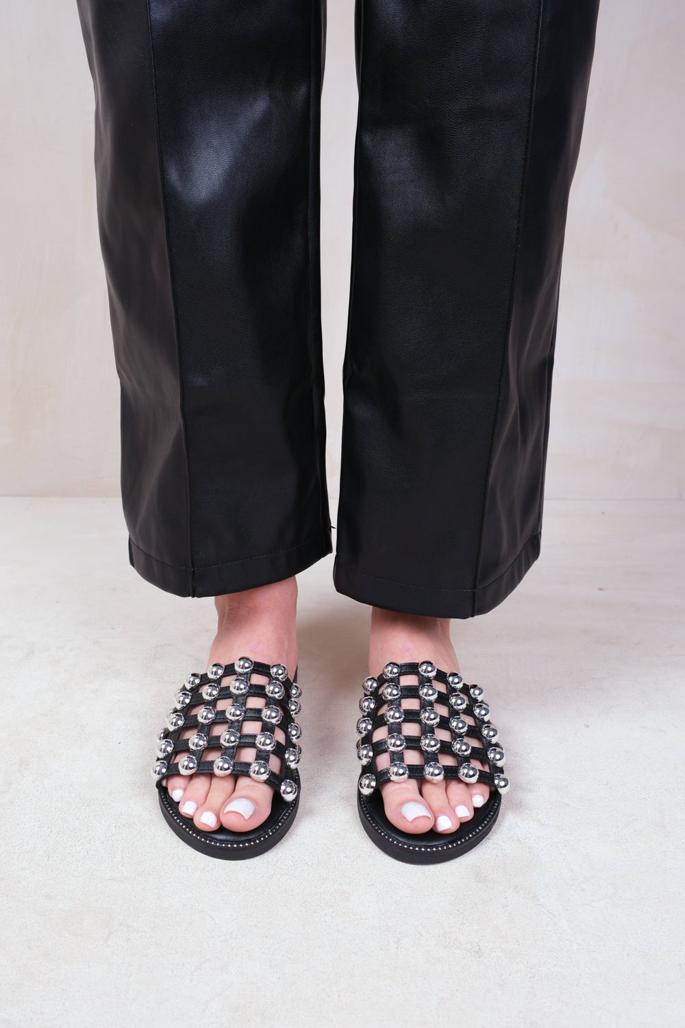 KELLY STUDDED SLIDER WITH CAGED STUDDED DETAILING IN BLACK FAUX LEATHER - Popular trends empire
