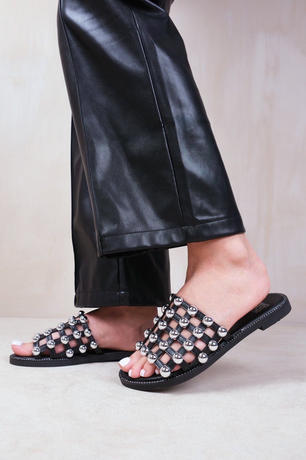 KELLY STUDDED SLIDER WITH CAGED STUDDED DETAILING IN BLACK FAUX LEATHER - Popular trends empire